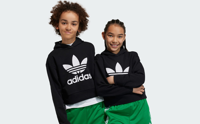 People wearing Adidas Kids Hoodies