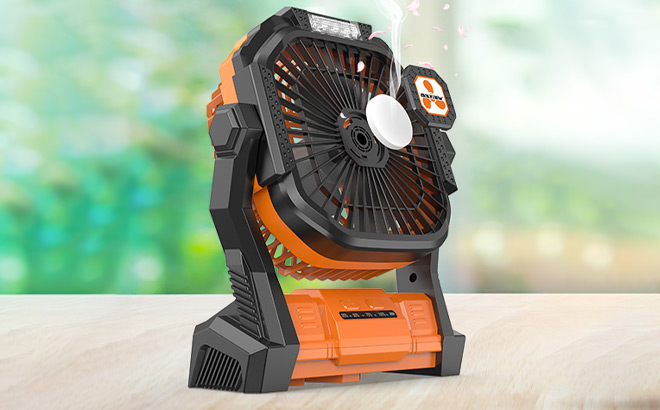 Small Table Fan in Orange Color on the Table