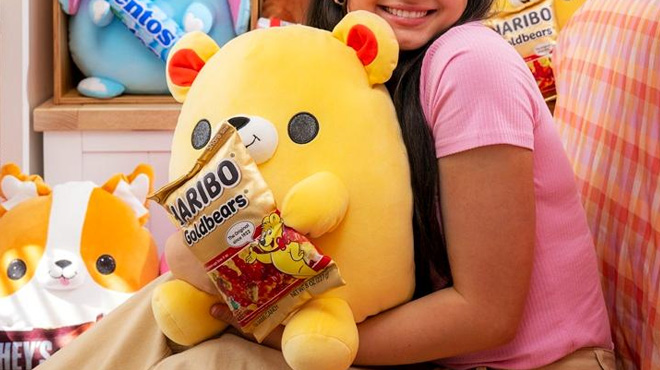 A Kid Holding Snackles Haribo GoldBears Super Sized 14 inch Plush