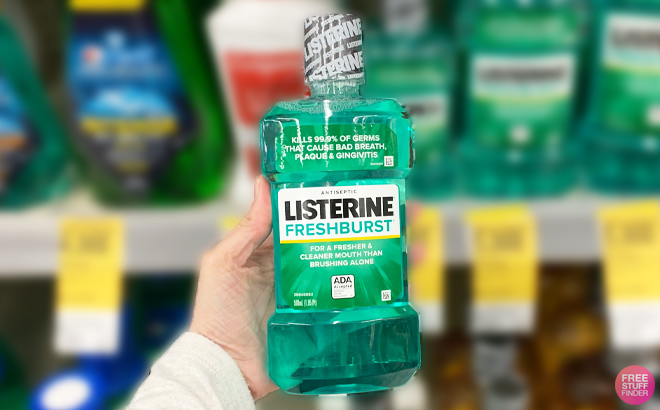 a Person Holding Listerine Fresh Burst Mouthwash