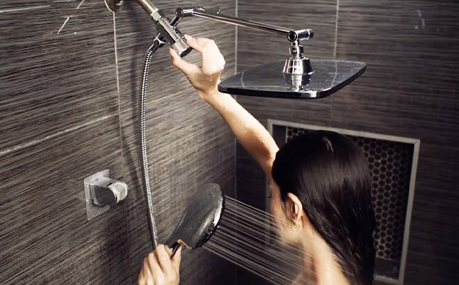 a Person Using High Pressure Rain Shower Head Combo with Adjustable Extension Arm