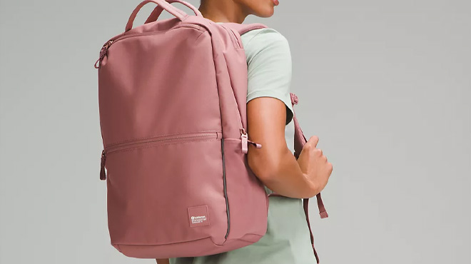 a Person with Lululemon Double Zip Backpack