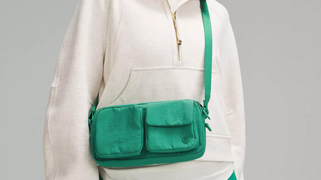 a Person with Lululemon Multi Pocket Crossbody Bag