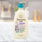 A Bottle of Aveeno Kids Face Body Wash on a Table