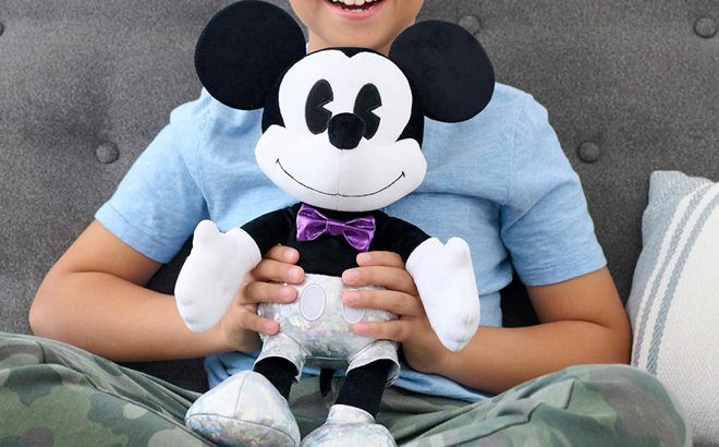 A Child Holding a Mickey Mouse Large Plush