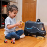 A Child Playing with an Amazon Delivery Van Ride On Toy