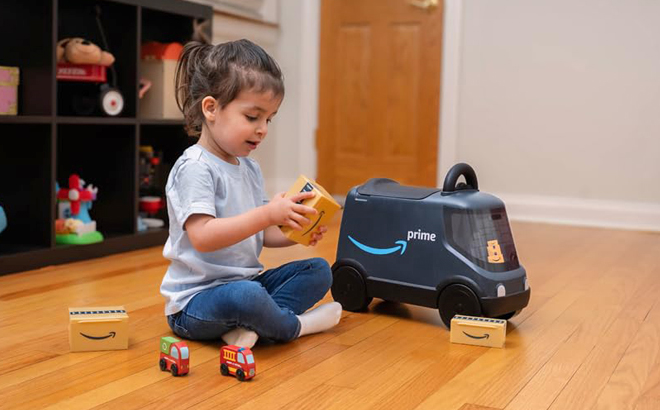 A Child Playing with an Amazon Delivery Van Ride On Toy