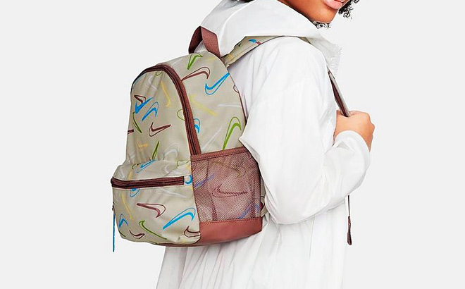 A Child with a Nike Kids Mini Backpack