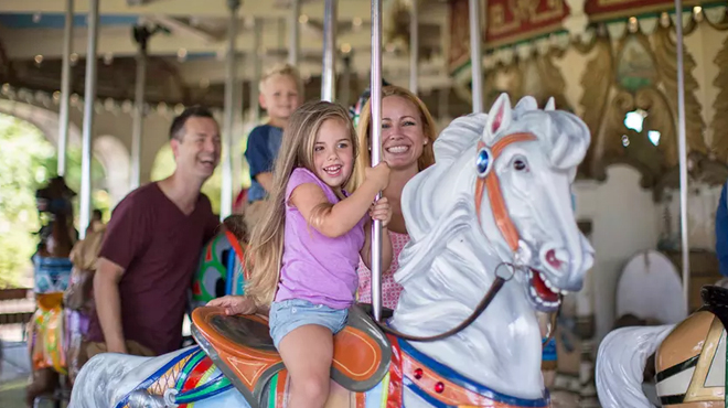 A Family at a Carousel at the Kings Dominion Soak City