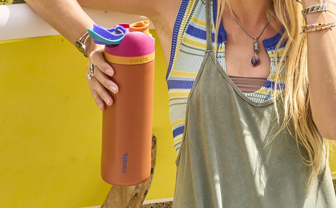 A Girl Holding a Water Bottle