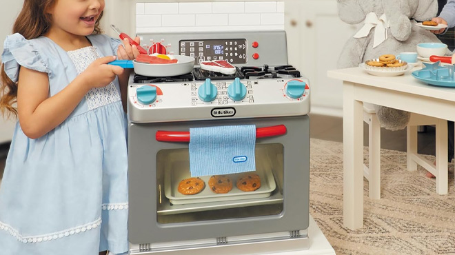 A Girl Playing with the Little Tikes First Oven Pretend Playset