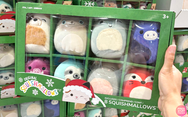 A Hand holding Christmas Ornament Squishmallows Animal Design 8 Pack Box