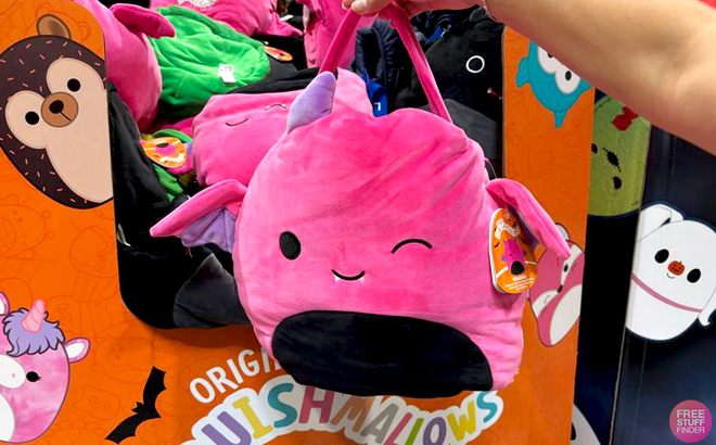 A Hand holding a Squishmallow 16 Inch Jumbo Treat Pail in Pink Color