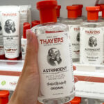 A Hand holding a Thayers Original Witch Hazel Facial Toner