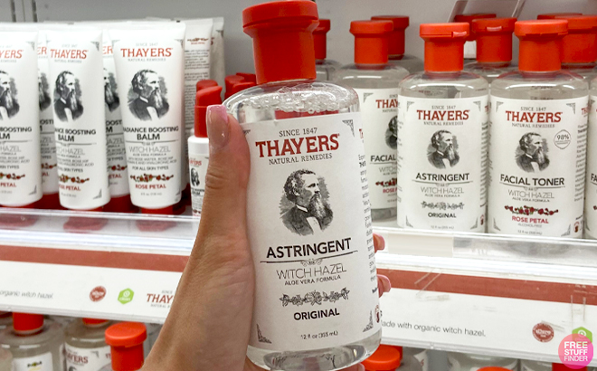 A Hand holding a Thayers Original Witch Hazel Facial Toner