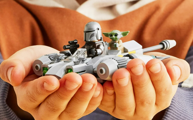 A Kid Holding a LEGO Star Wars The Mandalorians N 1 Starfighter Microfighter