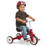 A Kid Riding Radio Flyer Triple Play Trike