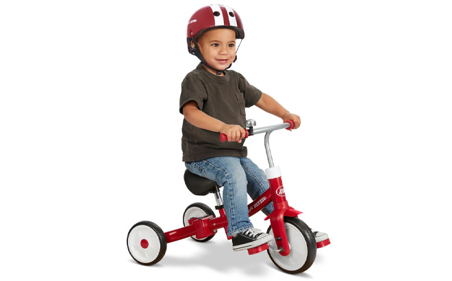 A Kid Riding Radio Flyer Triple Play Trike