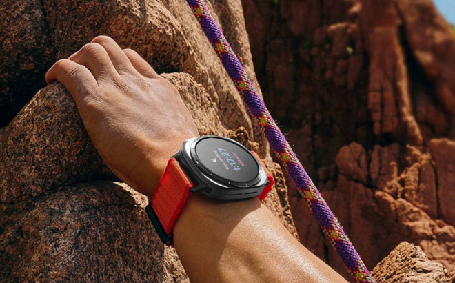 A Man Wearing Samsung Galaxy Watch Ultra While Mountain Climbing