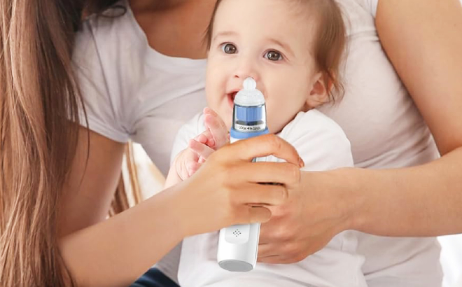 A Mother Using a Electric Nasal Aspirator on Baby