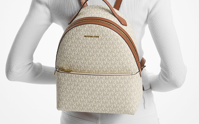 A Person Carrying the Michael Kors Sheila Medium Logo Backpack in White