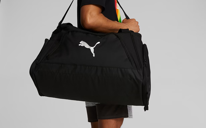 A Person Carrying the Puma Accelerator Duffle Bag