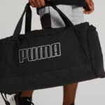 A Person Carrying the Puma Unisex Accelerator Duffle Bag