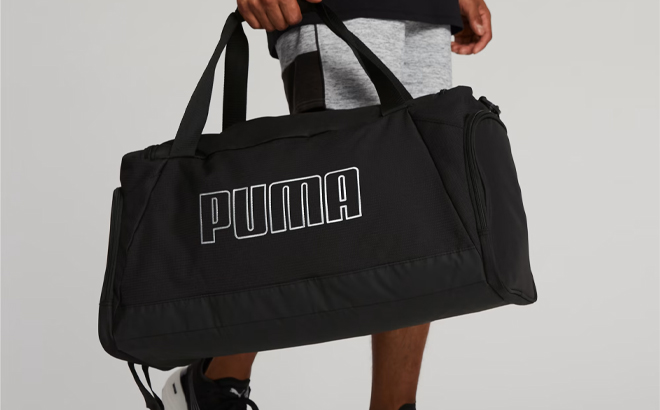 A Person Carrying the Puma Unisex Accelerator Duffle Bag