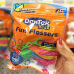 A Person Holding DenTek Kids Fun Flossers