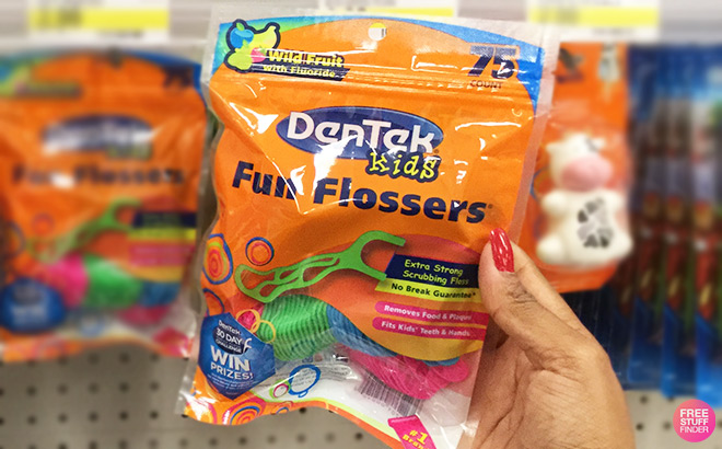 A Person Holding DenTek Kids Fun Flossers