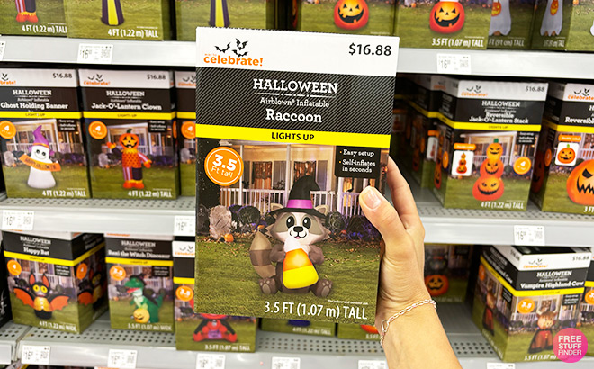 A Person Holding Halloween Witch Raccoon 3 5 Feet Yard Inflatable