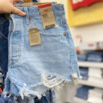 A Person Holding Levis 501 Original Jean Shorts