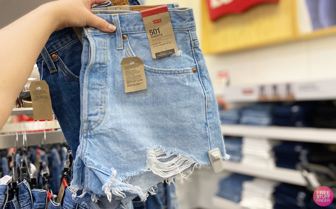 A Person Holding Levis 501 Original Jean Shorts