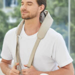 A Person Holding Neck Massager with Heat