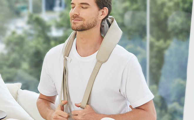 A Person Holding Neck Massager with Heat