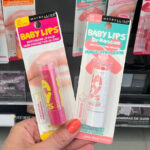 A Person Holding Two Maybelline Baby Lips Lip Balm