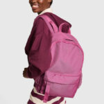 A Person Holding Victorias Secret Pink Ivy Classic Canvas Backpack