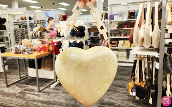 A Person Holding a A New Day Pearl Heart Minaudiere Top Handle Bag