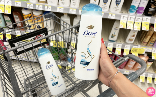 A Person Holding a Bottler of Dove Ultra Care Shampoo