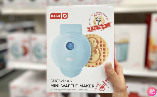 A Person Holding a Dash Mini Snowman Waffle Maker