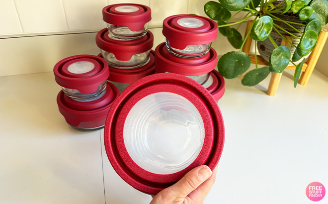 A Person Holding a Glass Storage Set