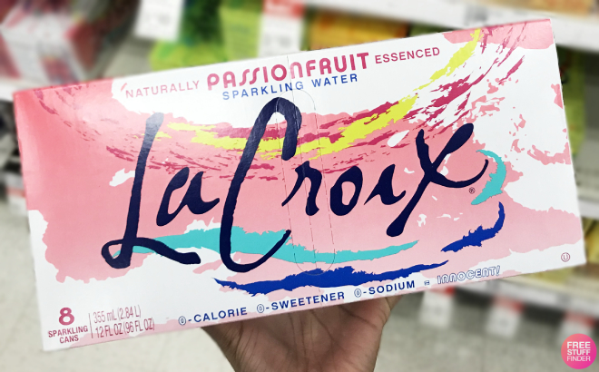 A Person Holding a Pack of LaCroix Sparkling Water Passionfruit Flavor