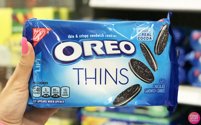 A Person Holding a Pack of Oreo Thins Cookies