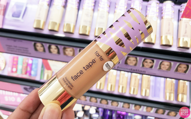 A Person Holding a Tarte Face Tape Foundation