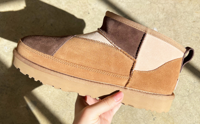 A Person Holding a UGG Womens Classic Ultra Mini ReImagined Boot