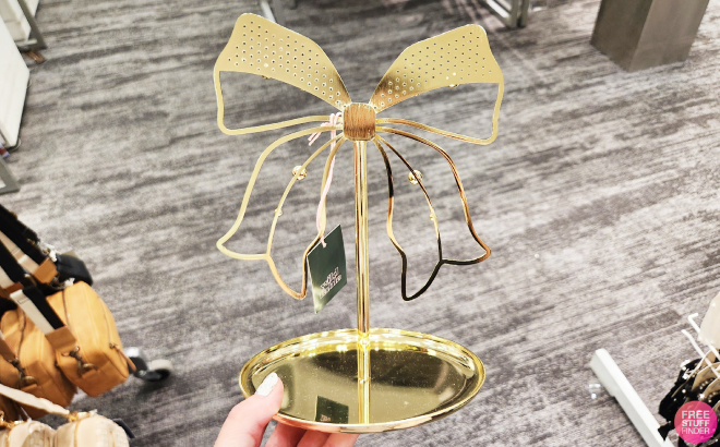 A Person Holding a Wild Fable Standing Bow Jewelry Organizer