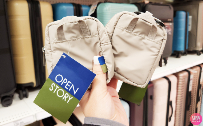 A Person Holding an Open Story Commuter Mini Pouches