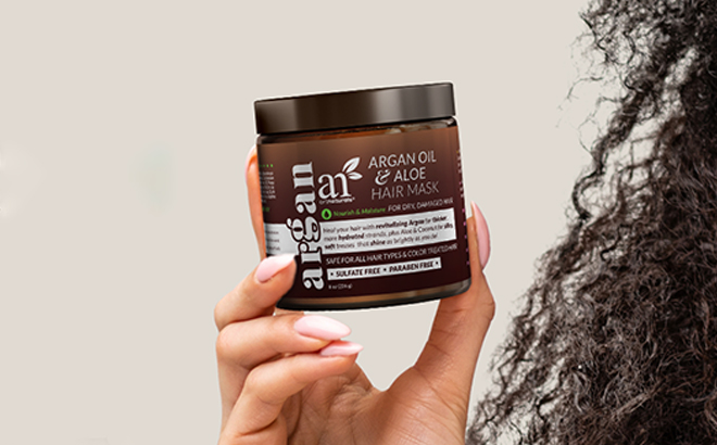 A Person Holding the Artnaturals Argan Oil Hair Mask