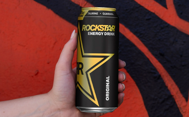 A Person Holding the Rockstar Energy Drink Original Flavor