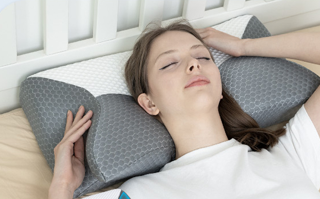 A Person Lying on a Cervical Pillow on a Bed